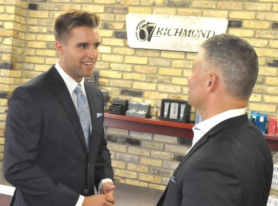 Aaron Ekblad (left) of the Barrie Colts chats with 67 Richmond St. owner Peter Leardi Friday afternoon after Ekblad was fitted for a suit at the Amherstburg clothing store. Ekblad, a Belle River native, will be wearing that Jack Victor suit on stage this Friday night at the NHL Draft in Philadelphia.